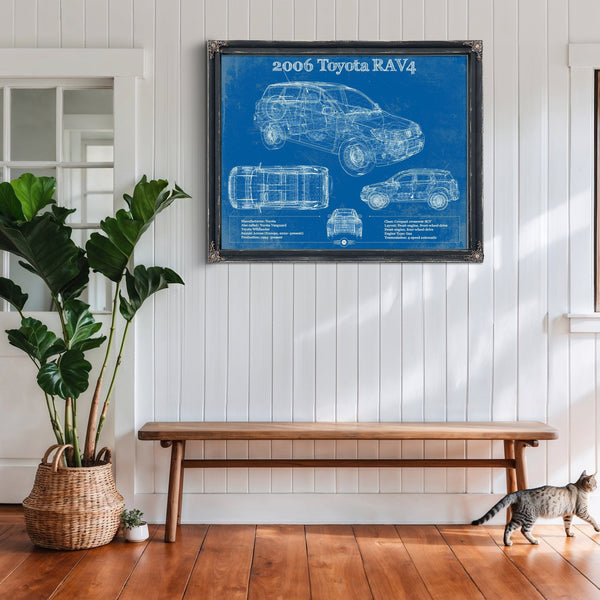 2006 Toyota Rav4 Blueprint Art Print framed in Vintage Black above a rustic console table