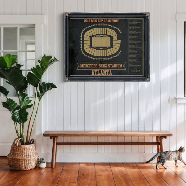 Atlanta United FC - Mercedes-Benz Stadium Print framed in Vintage Black above a rustic console table
