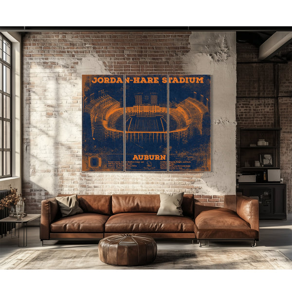 Auburn Tigers Jordan Hare Stadium Print as a 3 panel canvas wrap above a leather sofa