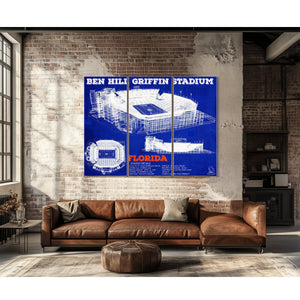 Ben Hill Griffin Stadium - University of Florida Print as a 3 panel canvas wrap above a leather sofa