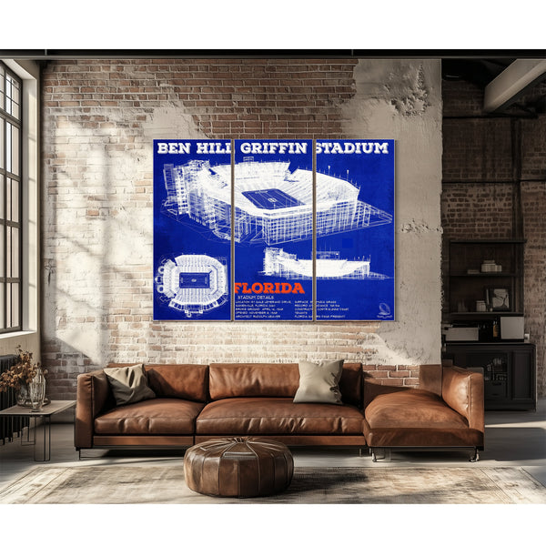 Ben Hill Griffin Stadium - University of Florida Print as a 3 panel canvas wrap above a leather sofa