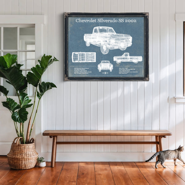2002 Chevrolet Silverado SS Blueprint Truck Print framed in Vintage Black above a rustic console table