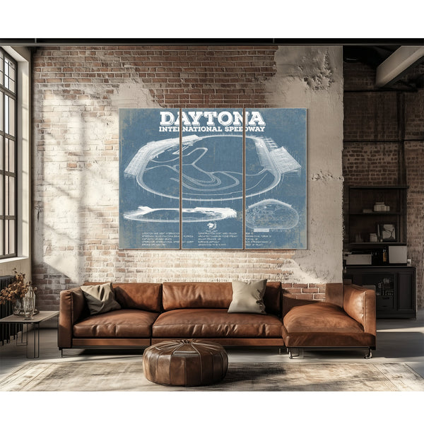 Daytona International Speedway Blueprint NASCAR Race Track Print as a 3 panel canvas wrap above a leather sofa