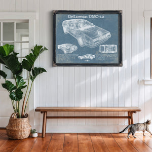 DeLorean Blueprint Art Print framed in Vintage Black above a rustic console table