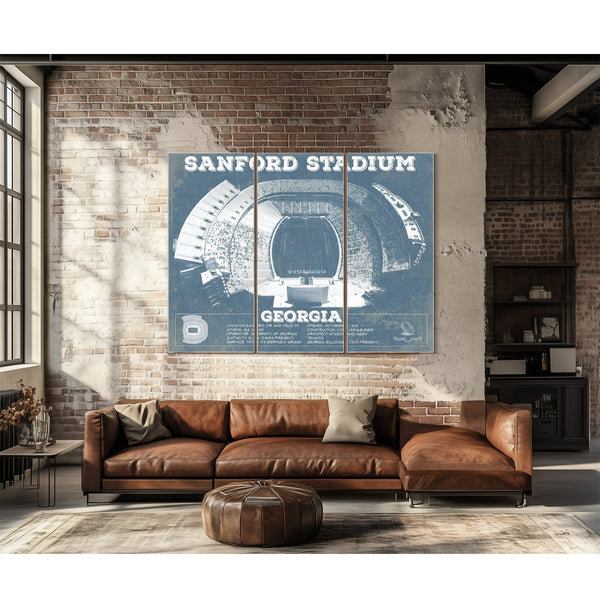 Georgia Bulldogs Football - Sanford Stadium Print as a 3 panel canvas wrap above a leather sofa