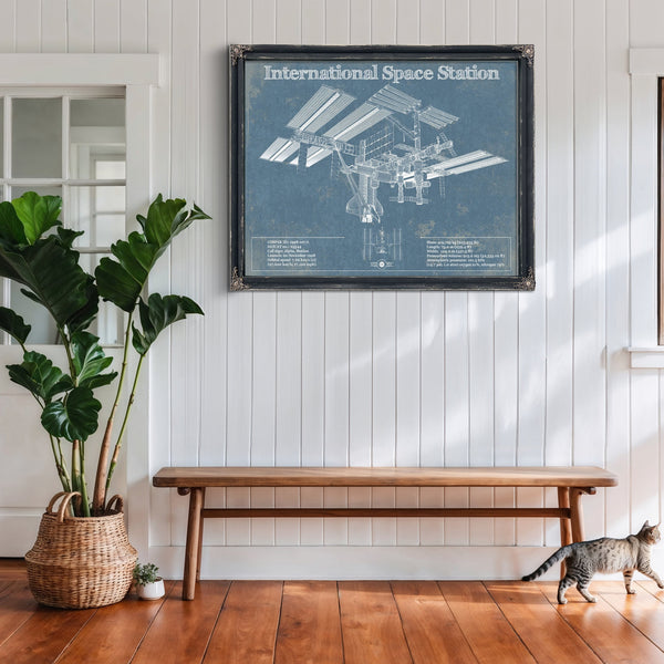 International Space Station Space Exploration Print framed in Vintage Black above a rustic console table