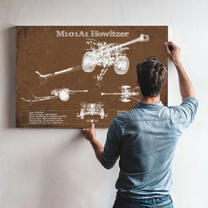 M101A1 Howitzer Art Print framed in Vintage Black above a mid-century record console