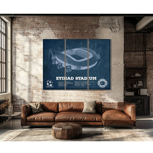 Manchester City FC- Etihad Stadium Print as a 3 panel canvas wrap above a leather sofa