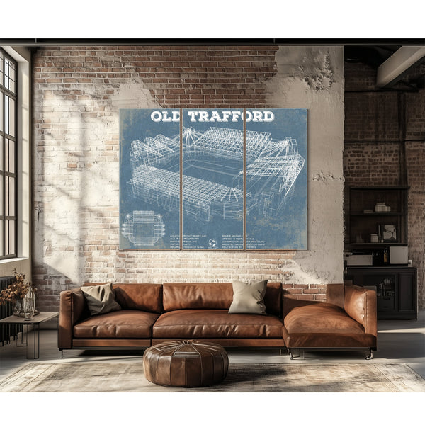 Manchester United FC - Old Trafford Stadium Print as a 3 panel canvas wrap above a leather sofa