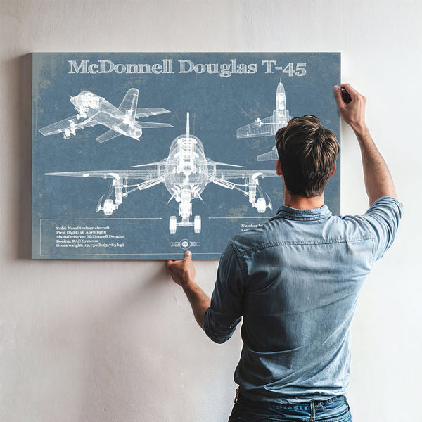 McDonnell Douglas T-45 Goshawk Print framed in Vintage Black above a mid-century record console