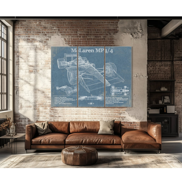 McLaren MP4-4 Formula One Blueprint Art Print as a 3 panel canvas wrap above a leather sofa