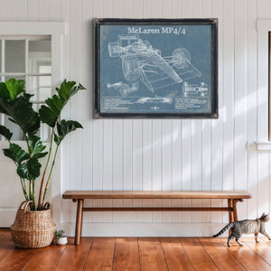 McLaren MP4-4 Formula One Blueprint Art Print framed in Vintage Black above a rustic console table