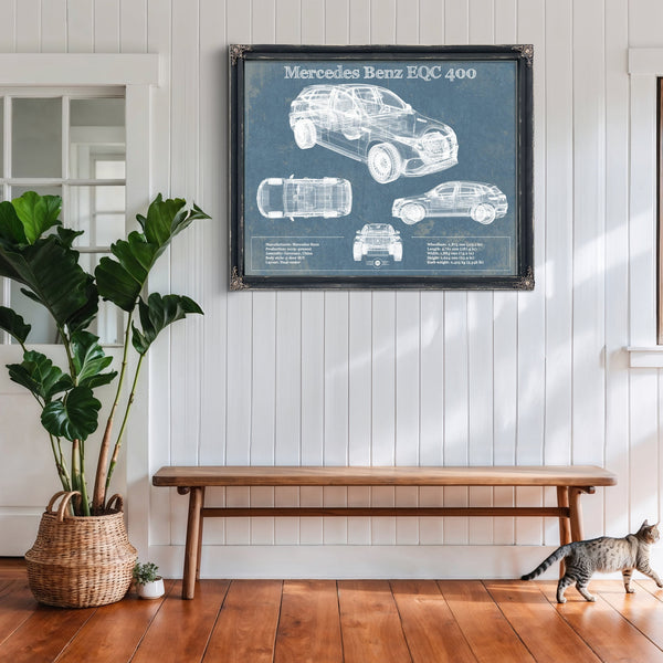 Mercedes-Benz EQC Blueprint Art Print framed in Vintage Black above a rustic console table