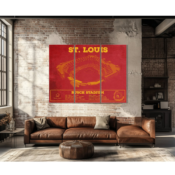 St Louis Cardinals - Busch Stadium Print as a 3 panel canvas wrap above a leather sofa