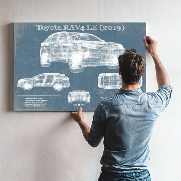 2019 Toyota RAV4 LE Blueprint Art Print framed in Vintage Black above a mid-century record console