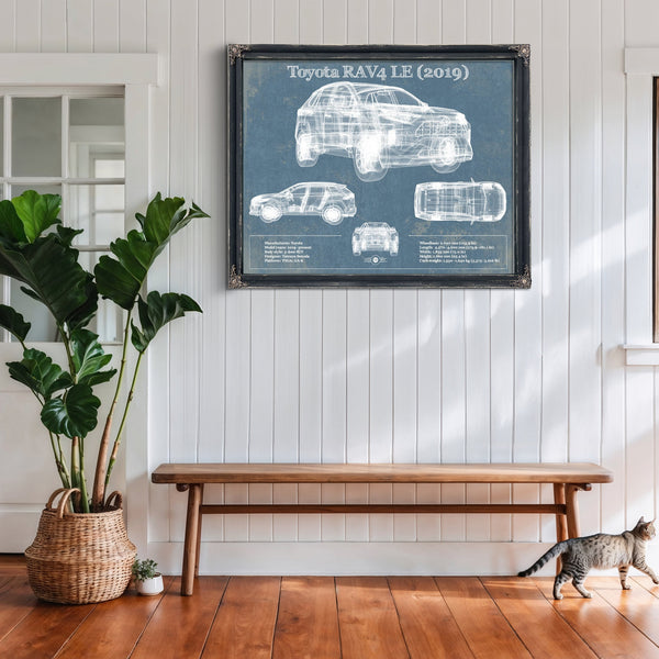 2019 Toyota RAV4 LE Blueprint Art Print framed in Vintage Black above a rustic console table