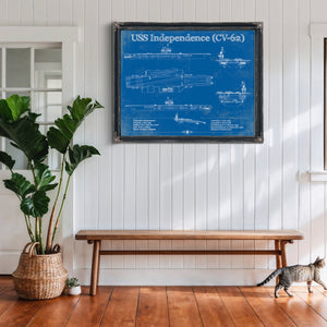 USS Independence Aircraft Carrier Print framed in Vintage Black above a rustic console table