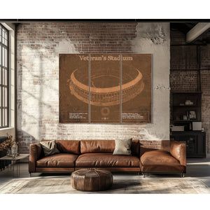 Veteran's Stadium - Philly Print as a 3 panel canvas wrap above a leather sofa