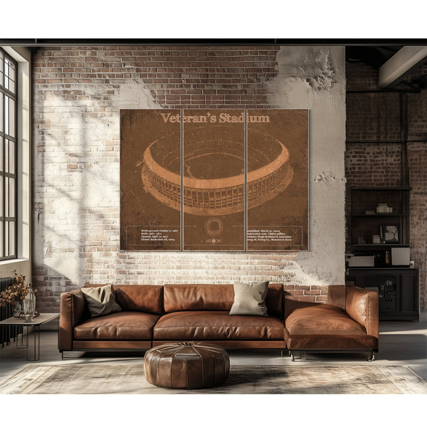 Veteran's Stadium - Philly Print as a 3 panel canvas wrap above a leather sofa